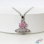 خرید گردنبند طرح سیاره و گل صورتی