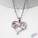 خرید گردنبند قلب و اینفینیتی نگین‌دار صورتی