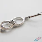 نیم ست نقره ۹۲۵ «اشک بی‌نهایت» (Rhodium Plated) | دو اشک در هم تنیده